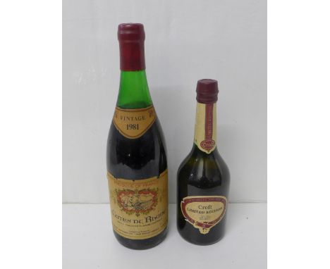 A bottle of vintage Cotes du Rhone 1981 wine and a bottle of Croft cased sherry 