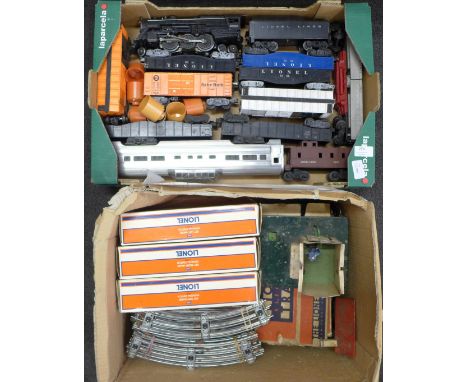 A collection of Lionel O gauge model railway including a Baby Ruth wagon, track, boxed points 