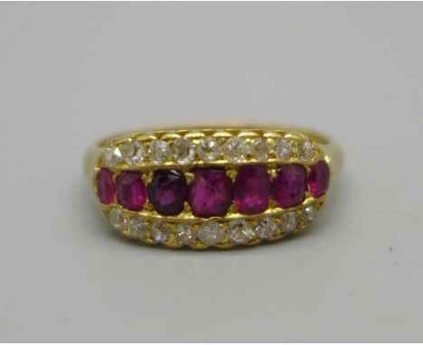 An 18ct gold, ruby and diamond triple row ring, 4.1g, O, one ruby possibly replaced 