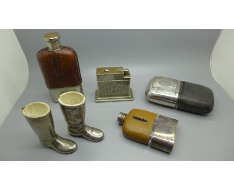 Three hip flasks, with silver plated cups, two Wellington boot match holders and a Myflam table lighter 