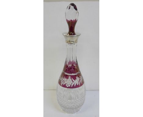 A ruby flash cut crystal decanter with silver top 