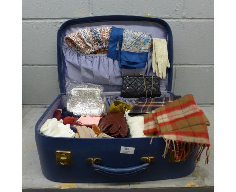 A vintage Antler suitcase with a collection of scarves including one Liberty print, silk and Pringle, seven pairs of leather 