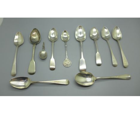 Nine silver spoons, 136g, a small continental silver caddy spoon and two plated spoons 