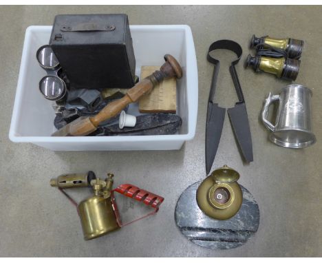 A collection of metal ware including binoculars, a camera, a military engraved pewter mug, a blow lamp, etc. **PLEASE NOTE TH