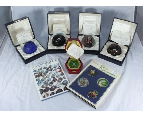 Four limited edition Caithness paperweights, Mystique 33/750, Space Flower 779/1000, Black Gem 175/1000 and Alien 45/2000, to