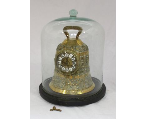 A 19th century brass mantel clock modelled as a bell, the dial with enamel Roman numerals denoting hours, the entire case orn