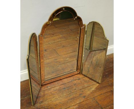 A large dressing table triple mirror with gold coloured bevelled edges and cut glass screw coverings (as found) 