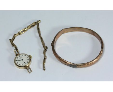 A 9ct gold ladies wristwatch, the white enamel dial with Arabic numerals denoting hours, subsidiary seconds dial and with ret