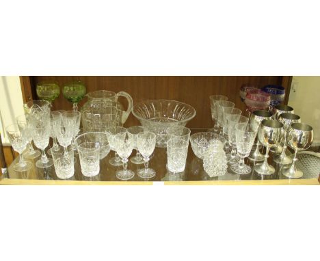 A shelf of assorted glassware including a set of six wine glasses, five various coloured glasses, five pewter goblets, large 