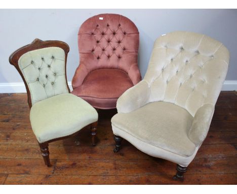 Two assorted nursing chairs, each with button-back fabric upholstery and raised on turned front supports to castors, together