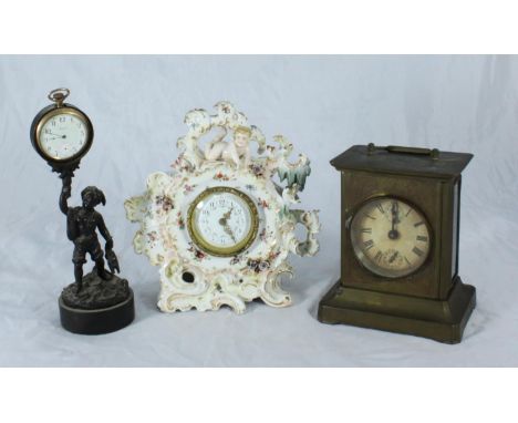 A 19th century continental porcelain clock in the rococo style surmounted with a putto, 20cm high, together with a brass-case