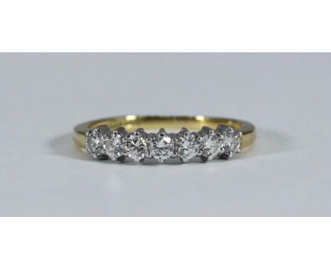 An 18ct gold seven-stone diamond ring, RBC diamonds estimated 0.70cts 