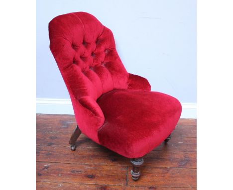 A button-back parlour chair in red velvet upholstery, raised on baluster front supports to castors, together with a mahogany 