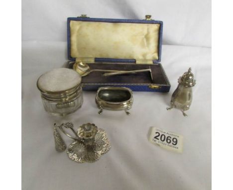 8 items of silver including cased spoon with pusher, thimbles, pepper pot, silver topped pot and miniature chamber stick.