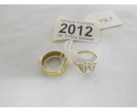 A 9ct gold wedding ring, size M and another 9ct gold ring, size K.
