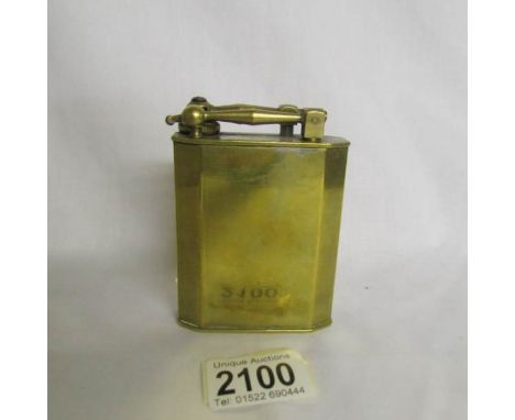 A brass Fujiama table lighter with applied plate for Ministere De Finances.