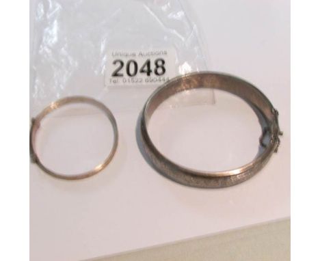 A child's silver bracelet and a silver bangle, approximately 24 grams.