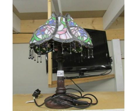 A table lamp with Tiffany style shade.