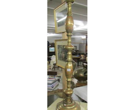 A brass standard lamp.