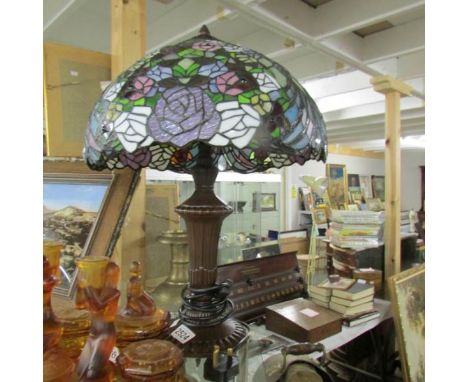 A table lamp with Tiffany style shade.