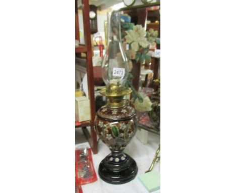 A Victorian Doulton Lambeth stoneware oil lamp complete with burner and chimney.