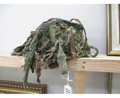 A military camouflage helmet
