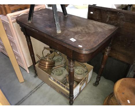 An Edwardian mahogany fold over card table