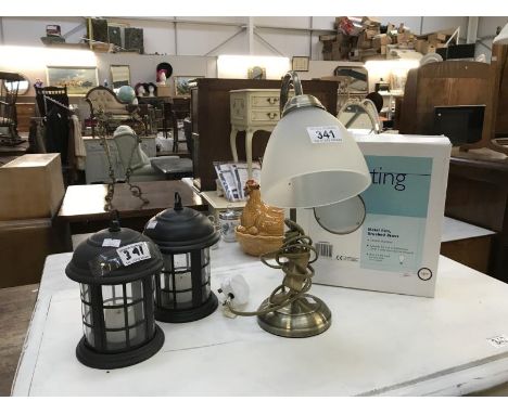 A lamp, two lanterns and one other light