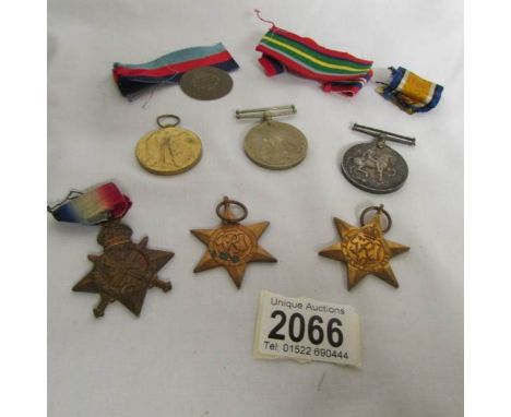 3 WW1 medals dedicated to 129 Pte C W Baccou, Lincoln regiment together with WW2 medals for his son R Ballau and a token ment
