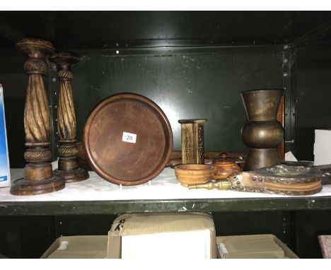 A shelf of wooden items incl. candle sticks etc.