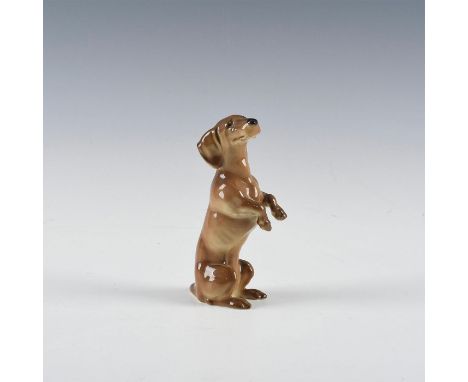 Model 707, begging from his hind legs. Hand painted and marked on the bottom.Dimensions: 5"HManufacturer: HutschenreutherCoun