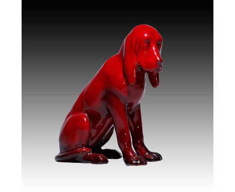 Seated Flambe Bloodhound. Model number 48. Also found with brown coloring, Doulton stamp on bottom with flambe.Issued: 1919Di