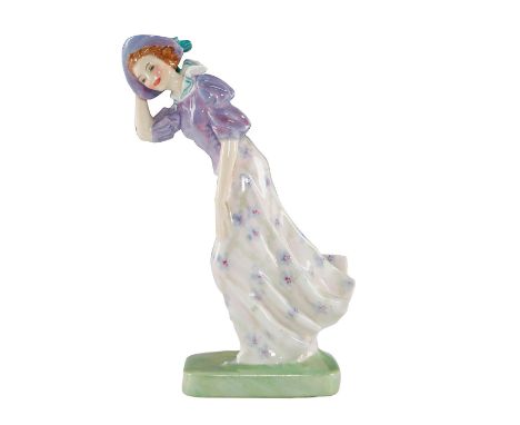 A young woman, the eponymously named "Windflower," caught in a heavy wind clutches her hat. A windflower is another name for 