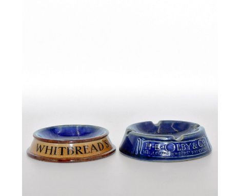 Impressed ROYAL DOULTON stamps to base. Â&nbsp;1. Glazed cobalt blue ground with white relief letters. H E OLBY &amp; CO. WHO