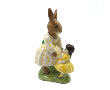 Bunny playing with a doll.Hand painted white and yellow dress. Artist: Walter Hayward and Albert HallamIssued: 1988Dimensions