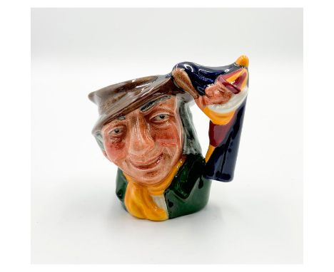 Smiling man wearing brown hat; green coat; yellow scarf.The miniature jug is based on a 17th century puppet show duo from Eng