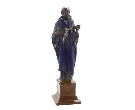 Man standing on pedestal playing a flute. Large early stunning figurine. HN34 No. 20 Doulton stamp on bottom.Issued: 1913Dime