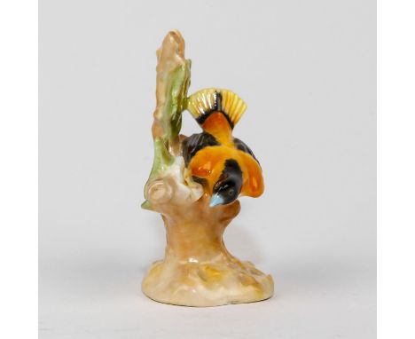 Style Four, Model 1130. Orange, black, white colorway.Issued: c. 1940Dimensions: 3"H x 2.5"WManufacturer: Royal DoultonCountr