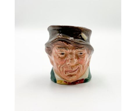 D6151; Brown hat; green coat; yellow and red scarf.Paddy, a colloquial term for an Irishman, is derived from St. Patrick, the