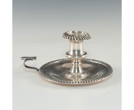 Round gadroon-shaped shallow basin with central taper.Styled in repousse. Dimensions: 5.75"D X 4"HCountry of Origin: England 