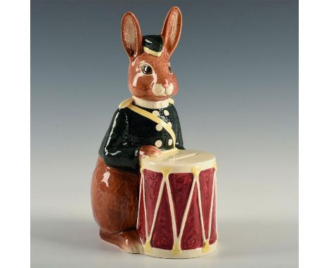 Large figure of a brown bunny in green coat with his drum.Royal Doulton backstamp. Artist: John Bromley &amp; David BiggsIssu