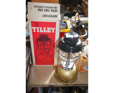 A boxed Tilley Storm Lamp with spares.