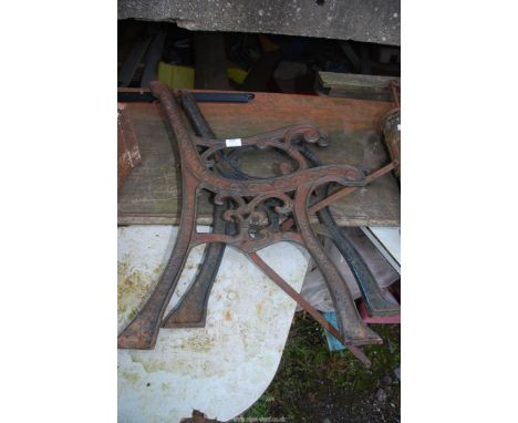A pair of cast iron bench ends.