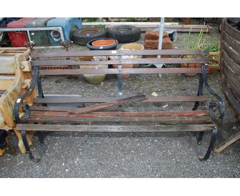 A wood and metal garden Bench, a/f., 5' wide x 30" high.