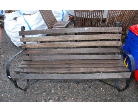 A slatted garden Bench with metal ends.