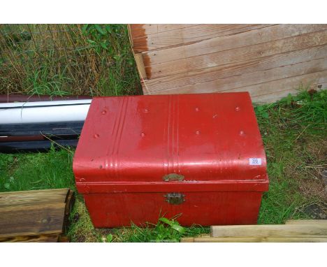 A painted tin trunk.