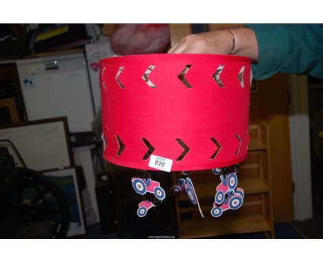 A child's Red tractor mobile light shade.