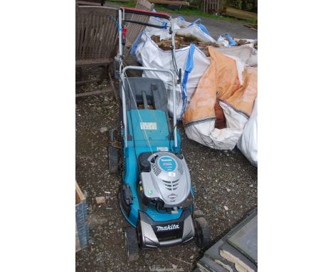 A "Makita" 4 stroke Mower, (engine turns at time of lotting, cables ceased).
