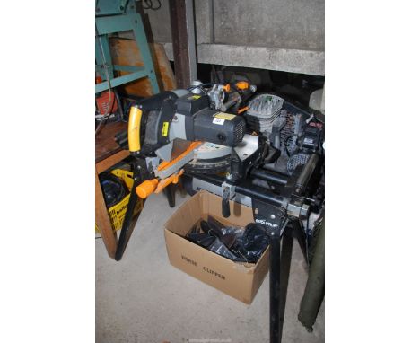 An "Evolution" Chop Saw on roller bench, 10" cutting blade.
