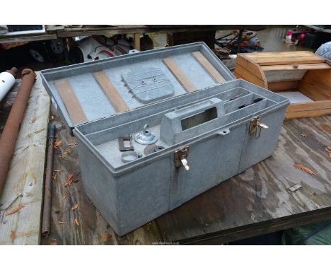 A fibre glass tool chest containing planes, screwdrivers, netting etc.